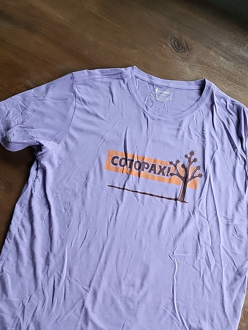 cotopaxi Lavender Tee with Orange Logo and Brown Tree